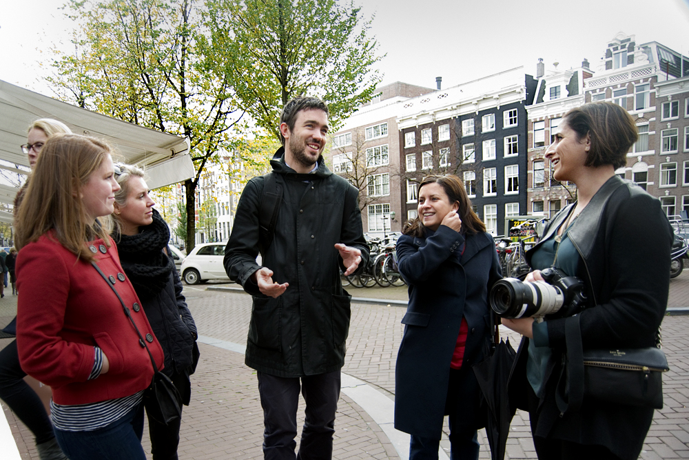  Docent, Tim, leading a private tour in Amsterdam. Flytographer, Traci White captured memories as they strolled. 
